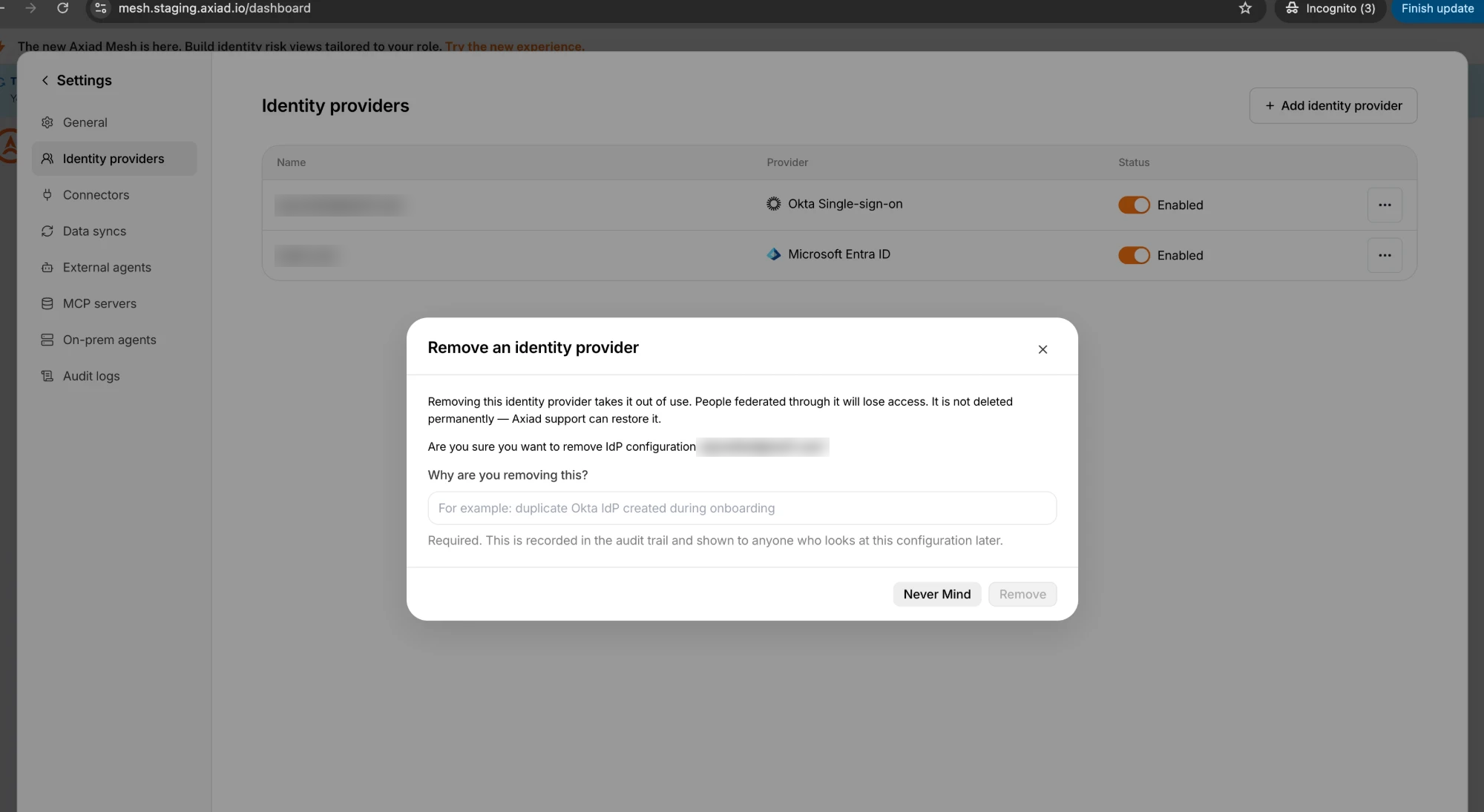Remove an identity provider dialog, explaining that the provider is not deleted permanently and that Axiad support can restore it, with an empty reason field and the Remove button unavailable